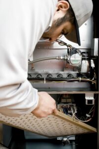 technician replacing hvac filter