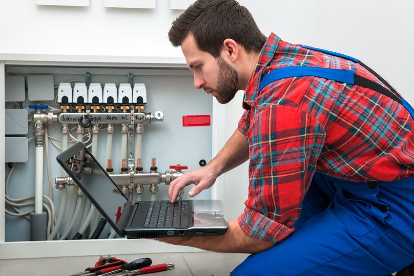 technician performing heating repair in colorado springs